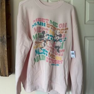 NWT Disney Parks pastel pink “meet me on Main Street” crewneck sweatshirt
